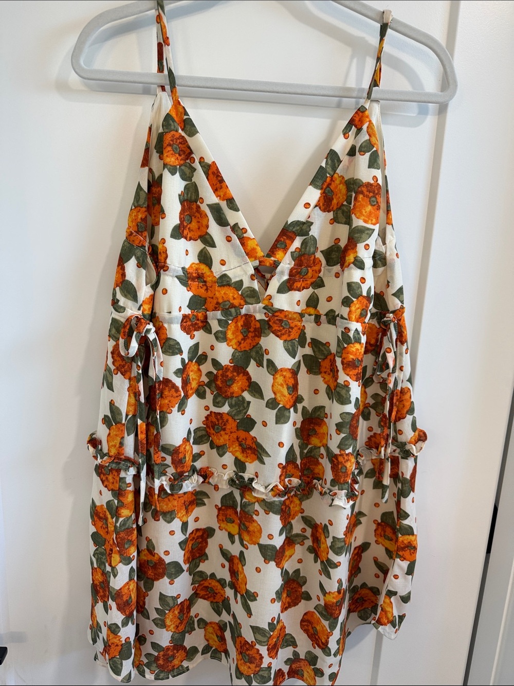 Lush White Floral Tunic with Orange Flowers and Green Leaves
